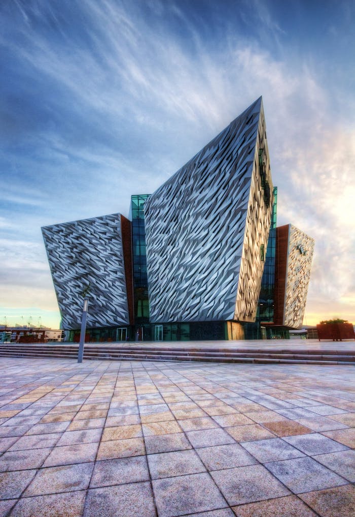 services-03 Impressive modern design of the Titanic Belfast museum, showcasing unique architectural style.